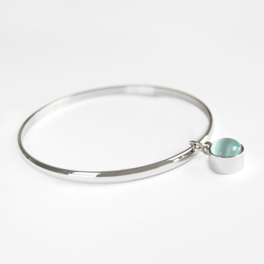 Pulseras para cenizas entero con perla azul.